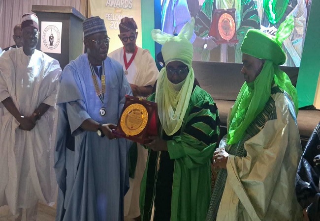 Emir of Zazzau Receives NIA’s Prestigious Honorary Fellowship By Sadiq Mohd, Zaria The Nigerian Institute of Architects (NIA) has conferred its Honorary Fellowship on the Emir of Zazzau, Malam Ahmed Nuhu Bamalli, in recognition of his contributions to cultural heritage preservation, traditional architecture and sustainable urban development. The prestigious honour, designated Honorary Fellow of the Nigerian Institute of Architects (Hon. FNIA), was conferred on the monarch on Thursday at the Bolton White Hotel, Wuse, Abuja, during the institute’s Fellows Investiture and Honours ceremony. The ceremony was presided over by the President of the NIA, Arc. Mobolaji Adeniyi, FNIA According to him, the award recognises distinguished Nigerians outside the architectural profession whose contributions to national development, advocacy for the built environment and support for the advancement of architecture have earned them national recognition.